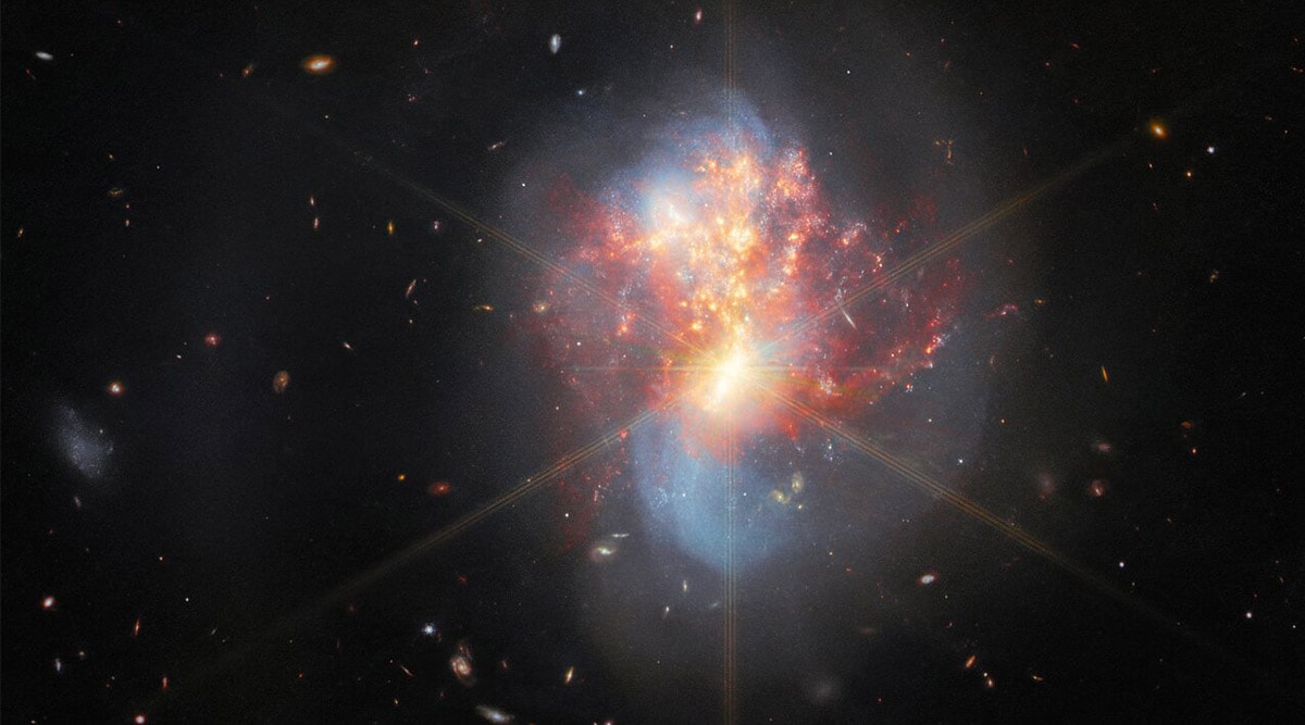 Webb captures galaxies merging through shroud of dust