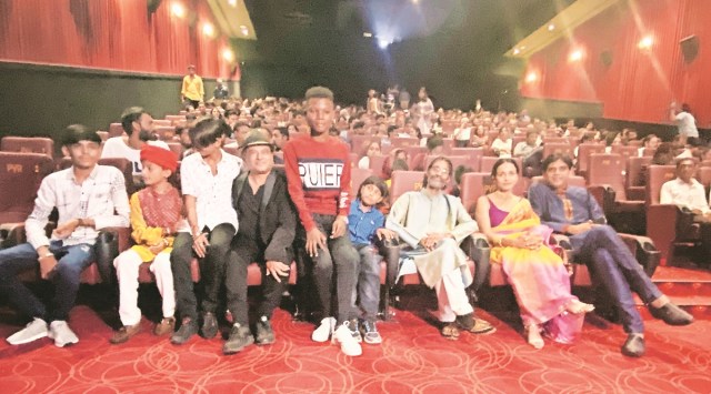 Actors and crew of the film Chhello Show watch the premiere in Ahmedabad, Friday. Express