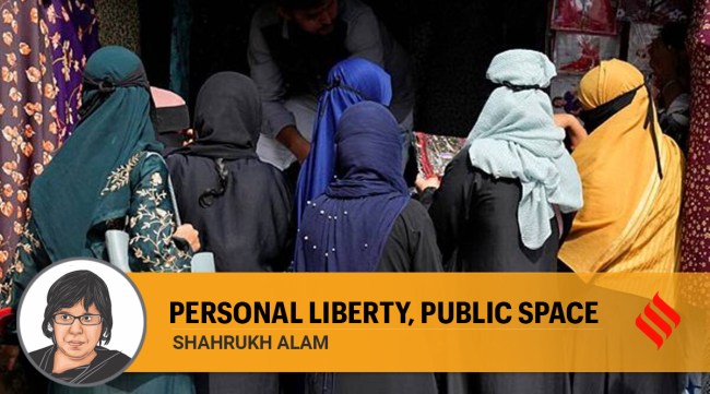 A group of veiled Muslim women shop for clothes in Bengaluru. (Photo: AP))