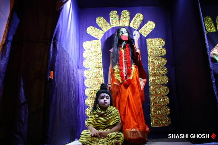 Kali Puja, Kali Puja 2022, Kali Puja in West Bengal, Kali Puja photos, living Goddess Kali, live Goddess Kali, people dressed as Goddess Kali, indian express news