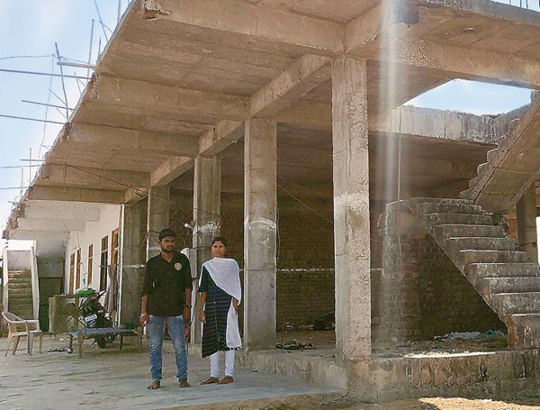 Kalladis son at their under construction family home. 1