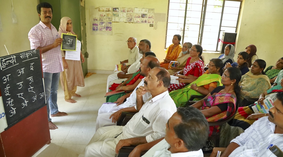 People attend a class to learn Hindi as part of an initiative by a panchayat to achieve 100 per cent Hindi literacy, at Chelannur in Kozhikode district, Sunday, Oct. 23, 2022. (PTI Photo)