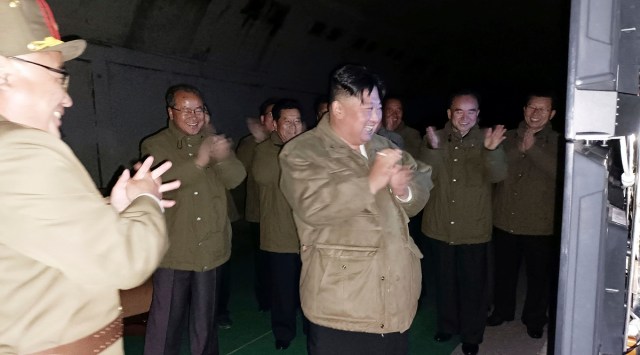 North Korean leader Kim Jong Un, center, supervises tests of long-range cruise missiles at an undisclosed location in North Korea Wednesday, Oct. 12, 2022. (Korea News Service/AP)