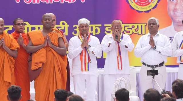 Rajendra Pal Gautam (4th from left) is seen on stage as attendees take an oath that they would not pray to Hindu gods and goddesses. (Twitter/@AdvRajendraPal)