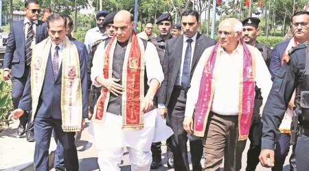 Rajnath Singh and Gujarat Chief Minister Bhupendra Patel arrive for the convocation ceremony. (Express Photo)
