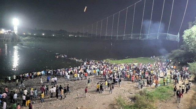 Rescue operation underway after an old suspension bridge over the Machchhu river collapsed in Morbi district on Sunday. (PTI)