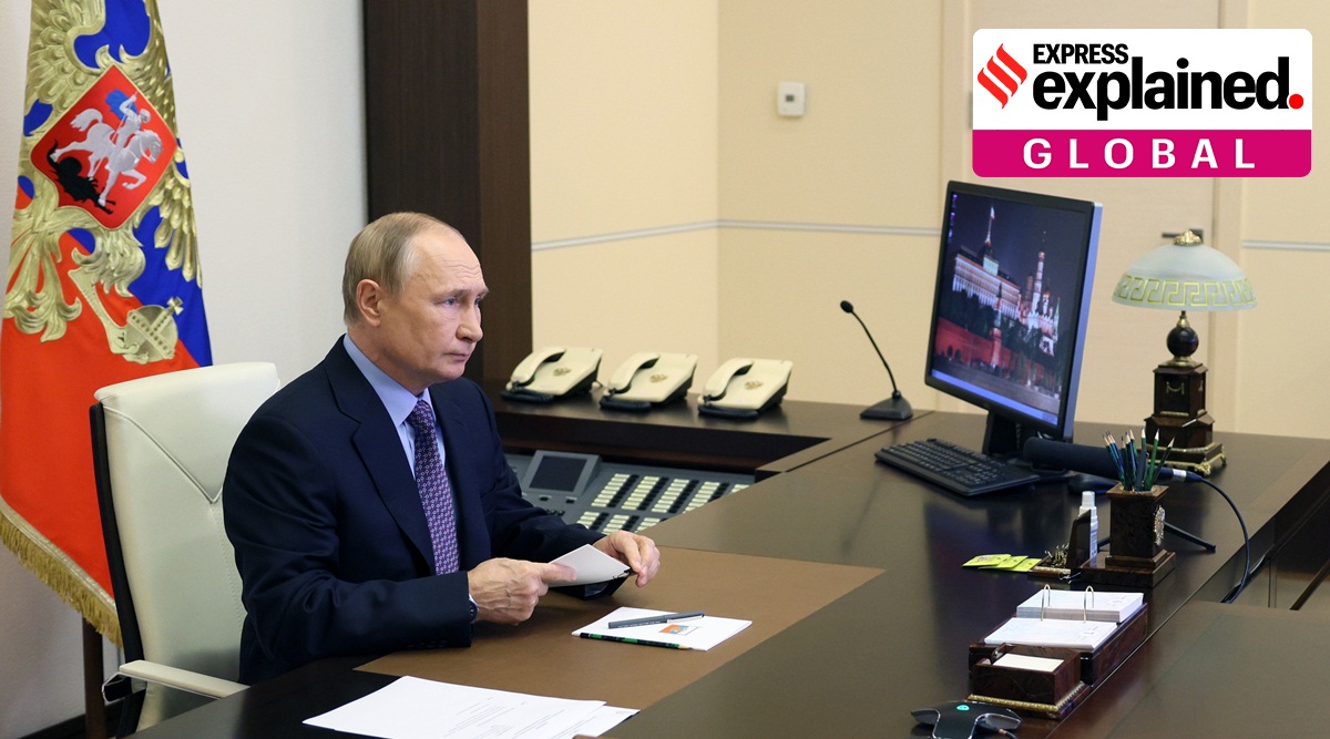 RUssian President Vladimir Putin seated