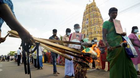 Lit torches are distributed to protesters, mainly relatives of those who disappeared amidst Sri Lanka's civil war, during a protest in Kilinochchi, Northern Province, Sri Lanka, on August 12, 2022. (REUTERS/Joseph Campbell)