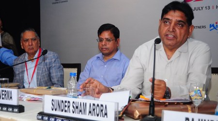 FILE-Sunder Sham Arora, addressing Punjab Apparel & Textile Conclave in Ludhiana on 13/7/2018 when he was Cabinet Minister in the Punjab Government. (Express/File photo)