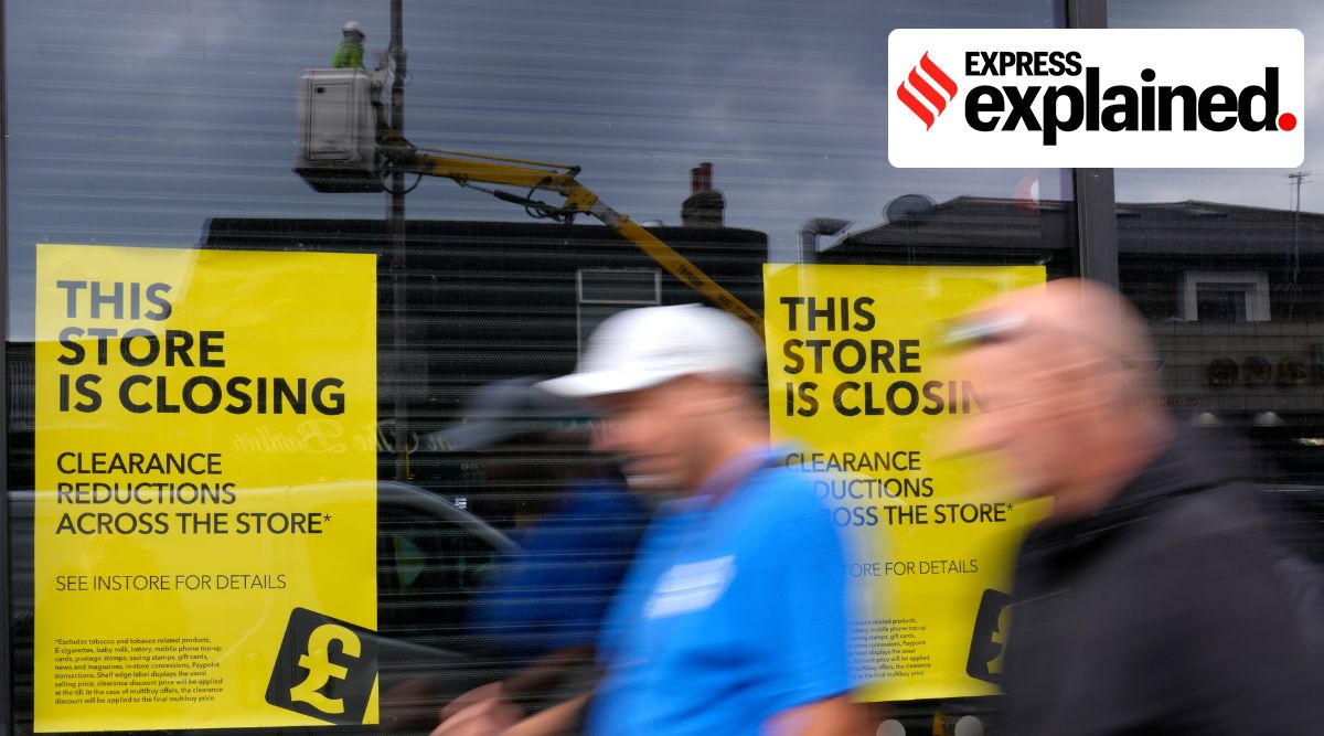 Pedestrians pass a closing down shop in London. (AP)