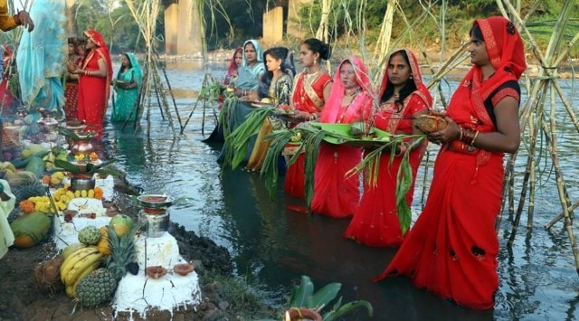 Chhath Puja at Mutha river on Sunday. (Express Photo by Pavan Khengre)