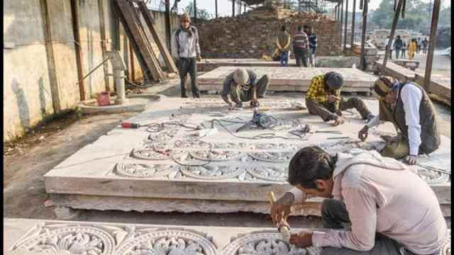Labourers carving and polishing stones at Ram Mandir construction site in Ayodhya (PTI/file)