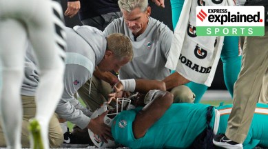 Miami Dolphins quarterback Tua Tagovailoa is examined during the first half of the team's NFL football game against the Cincinnati Bengals, Thursday, Sept. 29, 2022, in Cincinnati.