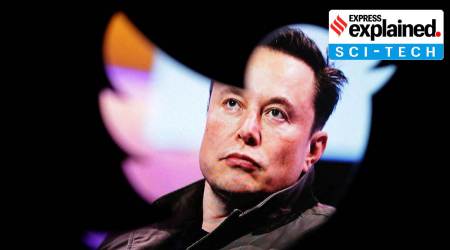 Elon Musk's photo is seen through a Twitter logo in this illustration taken October 28, 2022. (Reuters Illustration: Dado Ruvic)