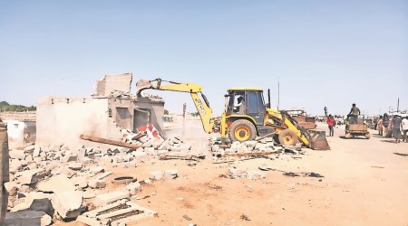 Demolition drive in progress in Jakhau Thursday. (Express photo by Satish Thakkar)
