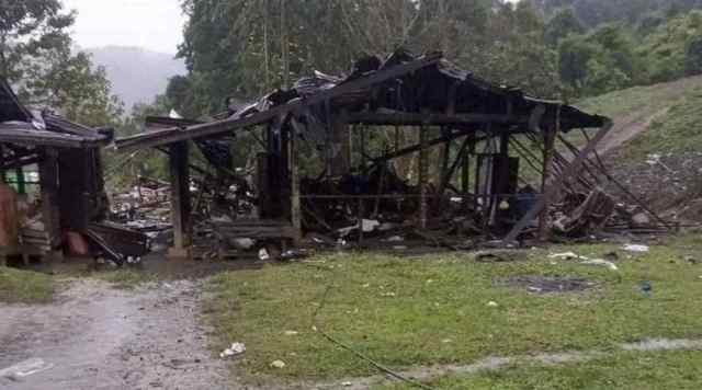 Debris are scattered around destroyed wooden structures near Aung Bar Lay Village, Hpakant township, Kachin state in Myanmar Monday, Oct. 24, 2022.(AP Photo)