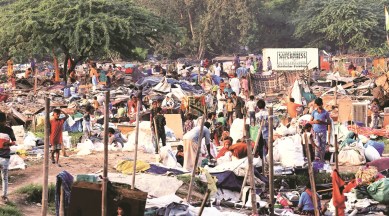 After officials left, residents were left staring at remains of their homes. (Express Photo by Praveen Khanna)