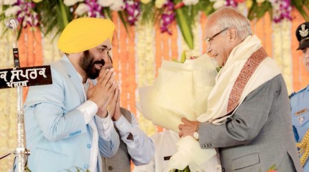 Punjab Governor Banwarilal Purohit with Bhagwant Mann during the latter's oath-taking ceremony. (Express Photo/File)