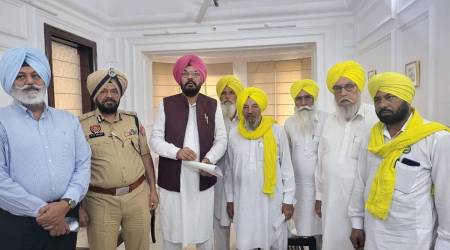 Punjab's agriculture minister Kuldeep Singh Dhaliwal ( third from left ) standing with Joginder Singh Ugrahan, president of BKU Ugrahan ( fourth from left ) and other members committee of BKU Ugrahan in Patiala on Friday afternoon. 