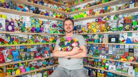 rotating puzzle collector florian kastenmeier sits in his room full of puzzles at his home in germany