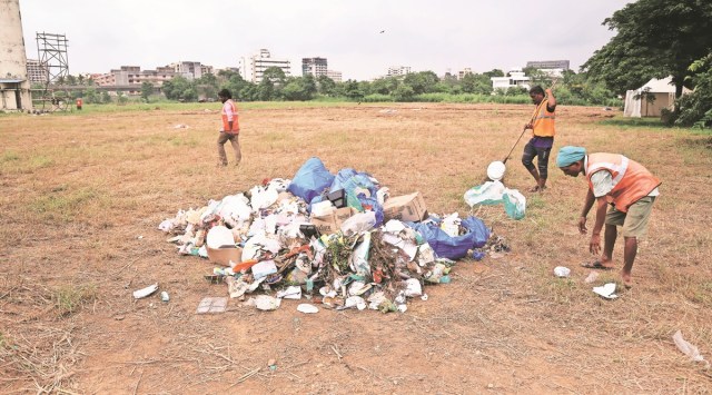 Civic workers clean the Kalina campus of Mumbai University on Thursday. (Express photo by Amit Chakravarty)