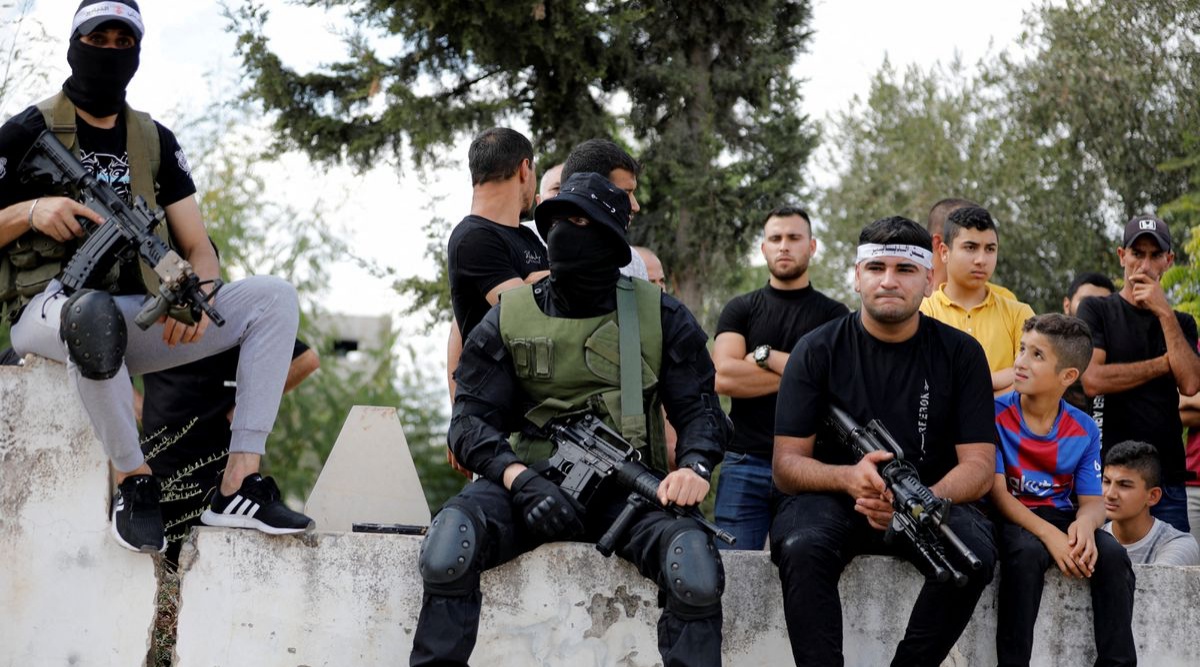 Armed men attend the funeral of Palestinian Mahmoud Al-Sous, who was killed by Israeli forces during clashes in raid, in Jenin in the Israeli-occupied West Bank. (Reuters/ Raneen Sawafta)