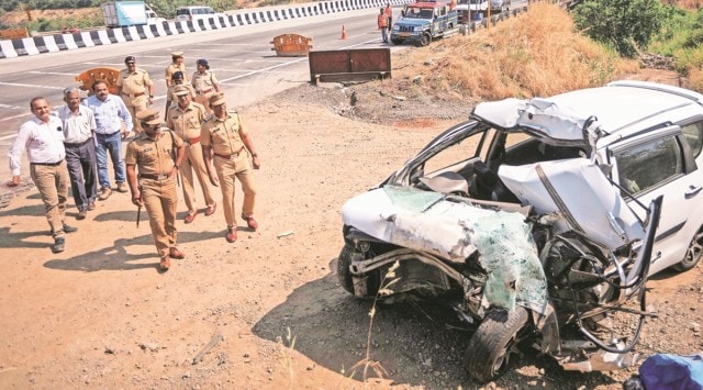 Police personnel  inspect the wreckage of the car after a collision with a vehicle on Mumbai-Pune Expressway near Khopoli, in Raigad district on Friday.  PTI