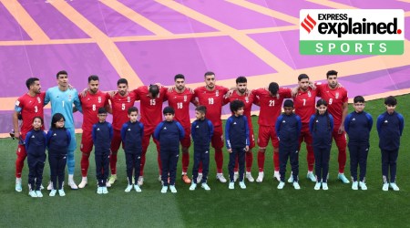 Iran players line up during the national anthems before the match against England.