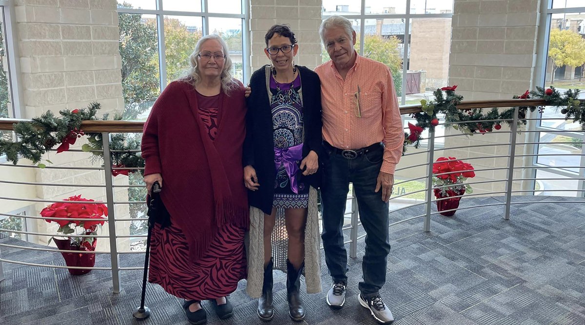 A photo via the Highsmith family of Melissa Highsmith, center, with her mother, Alta Apantenco, and father, Jeffrie Highsmith, at a Labcorp testing facility in Fort Worth, Texas. (via The New York Times)
