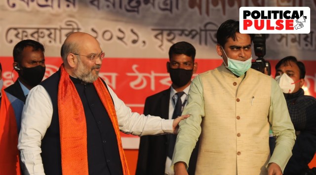 Union Home Minister Amit Shah with Santanu Thakur, one of the top Matua leaders in the BJP. (Express Photo: Partha Paul, File)