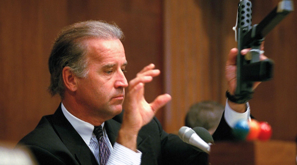 Sen. Joe Biden, D-Del., chairman of the Senate Judiciary Committee, holds a TEC-9 semi-automatic pistol during a hearing of the committee on Capitol Hill, Aug. 3, 1993, as the committee holds hearings on combating the proliferation of assault weapons. (AP File Photo)
