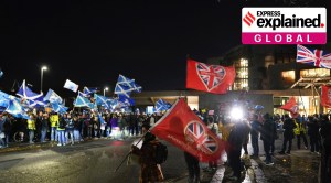 Supporters and opponents of Scottish independence waving their flags and banners at a rally outside the Scottish Parliament in Edinburgh