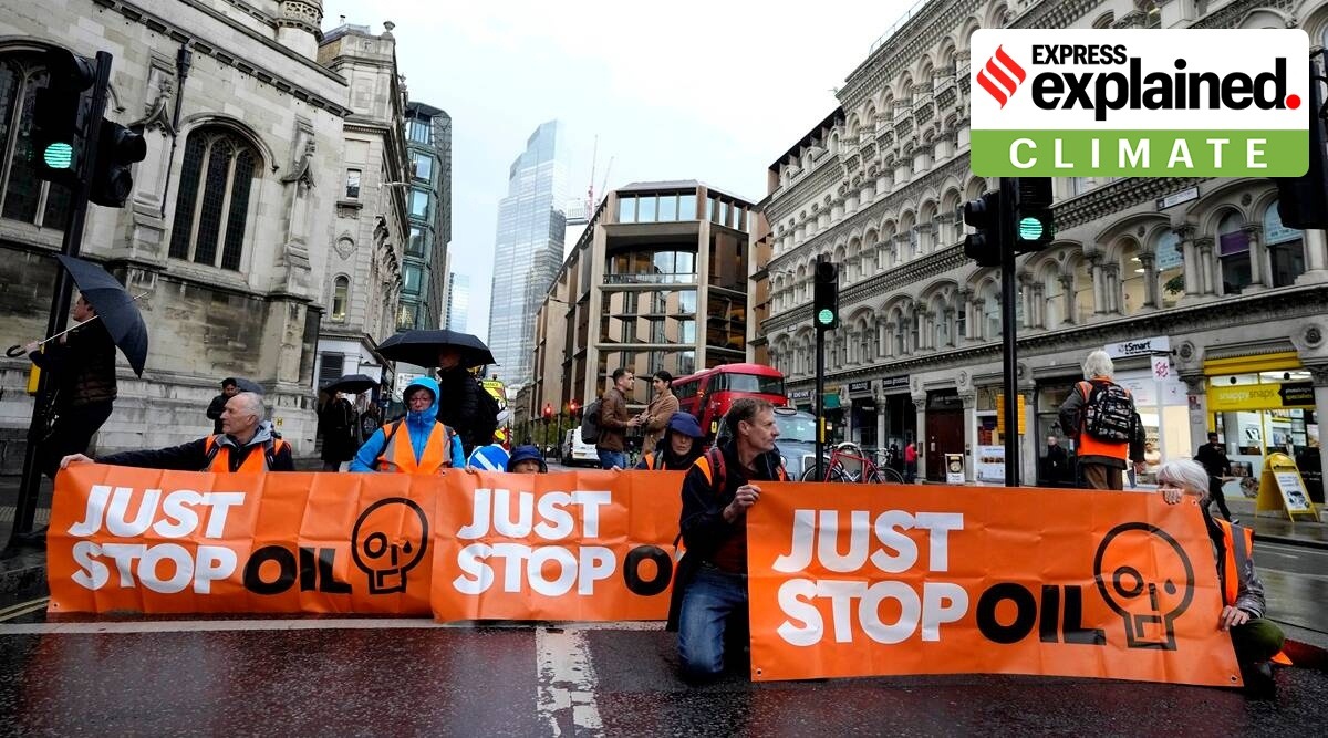 Activists from the group Just Stop Oil block a road in London, Thursday, Oct. 27, 2022 demanding to stop future gas and oil projects from going ahead.(AP Photo/Kirsty Wigglesworth)