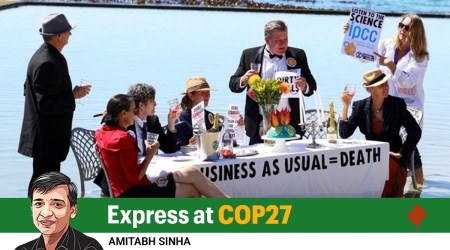 Climate activists stage a piece of street theatre on a beach during COP27 to highlight the fact that fossil fuel "Business as Usual" is leading to climate disasters such as sea level rise. (Reuters Photo: Esa Alexander)
