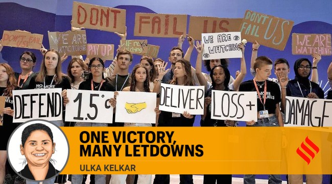 Youth activists hold signs encouraging world leaders to maintain policies that limit warming to 1.5 degrees Celsius since pre-industrial times and provide reparations for loss and damage at the COP27 UN Climate Summit, November 19, 2022, in Sharm el-Sheikh, Egypt. (AP)