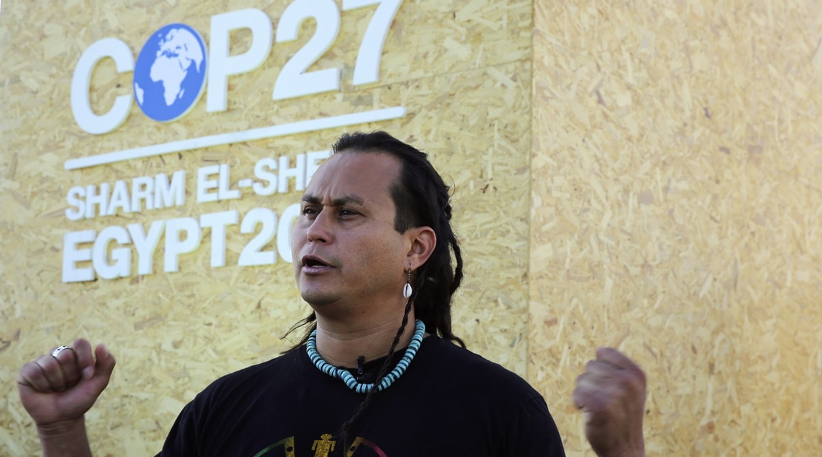 Jacob Johns, climate activist a member of the Akimelo‚ Aootham and Hopi nations in the United States, speaks during an interview with The Associated Press outside the COP27 U.N. Climate Summit venue, in Sharm el-Sheikh, Egypt, Saturday, Nov. 12, 2022. (AP Photo)