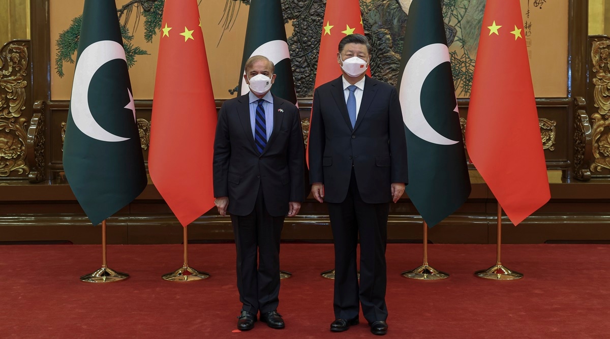 In this photo released by Xinhua News Agency, Chinese President Xi Jinping, right, poses with Pakistani Prime Minister Shahbaz Sharif before their bilateral meeting at the Great Hall of the People in Beijing, Wednesday, Nov. 2, 2022 (Yao Dawei/Xinhua via AP)