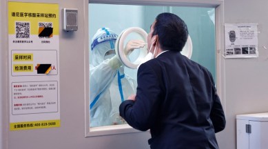 A man gets a swab test at a testing booth as the outbreak of coronavirus disease (COVID-19) continues in Beijing, China, November 5, 2022. (REUTERS)