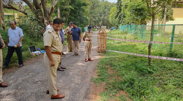 Commissioner of Police Pradeep Gunti (Law and Order ) inspects the site where RN Kulkarni was found dead, at Manasa Gangotri area of Mysuru on Sunday. (PTI)