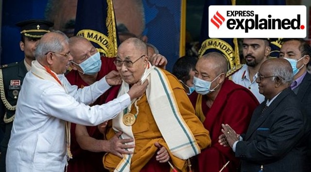Tibetan spiritual leader the Dalai Lama receives the Gandhi Mandela award from Himachal Pradesh governor Rajendra Arlekar at the Tsuglakhang temple in Dharamshala, on Saturday. (AP Photo)