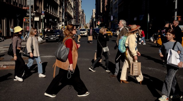 Pedestrians crossing Broadway in the Soho neighborhood of Manhattan, Oct. 27, 2022. Consumer Price Index data released on Nov. 10  showed that inflation cooled more than expected in October, welcome news for the Federal Reserve and White House after months of limited progress on bringing down inflation. (Amir Hamja/The New York Times)
