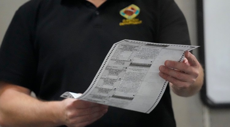 An election worker processes a ballot at the Clark County Election Department on Nov. 9, 2022, in Las Vegas. (AP)