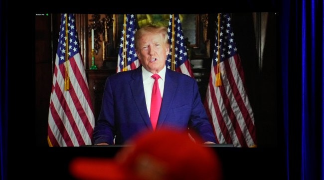 People listen as former President Donald Trump speaks remotely to an annual leadership meeting of the Republican Jewish Coalition in Las Vegas. (AP)