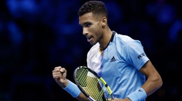 Canada's Felix Auger Aliassime celebrates winning his group stage match against Spain's Rafael Nadal. (REUTERS) 