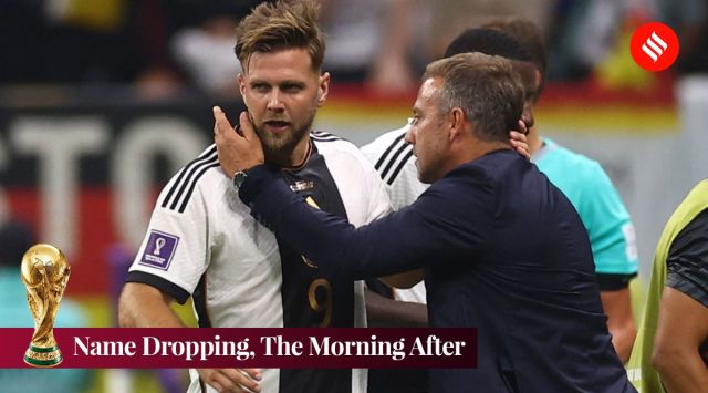 Germany's Niclas Fullkrug celebrates scoring their first goal with coach Hansi Flick. (Reuters)