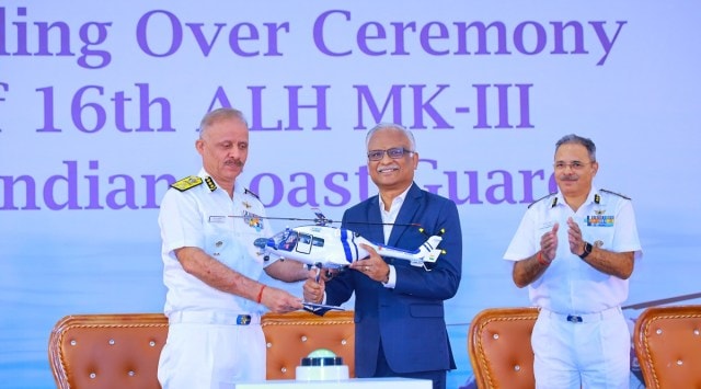HAL MD C B Ananthakrishnan hands over the 16th ALH Mk-III chopper to DG Coast Guard V S Pathania on Tuesday. (Express Photo)