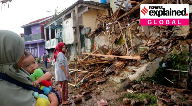 Residents inspect houses damaged by Monday's earthquake in Cianjur, West Java, Indonesia Tuesday, Nov. 22, 2022. (AP Photo/Rangga Firmansyah)