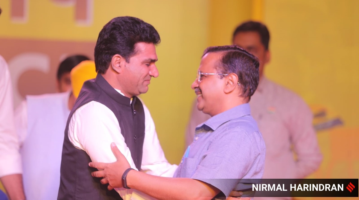 AAP's CM candidate in Gujarat Isudan Gadhvi with Delhi CM Arvind Kejriwal on Friday. (Express Photo: Nirmal Harindran)