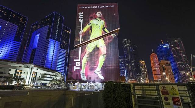 A giant FIFA World Cup advertisement on a skyscraper shows Germany's goalkeeper Manuel Neuer, reading "talent" in the center of Doha. (AP)