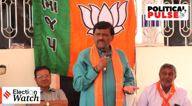Kantilal Amrutiya during his election campaigning in a village, in Morbi district on Thursday. (Express photo) 